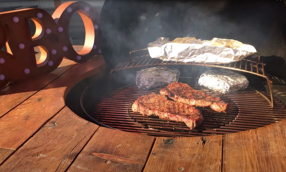 cook steak on charcoal grill